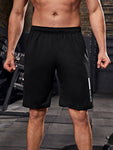 Manfinity Fitness Men Letter Graphic Slant Pocket Sports Stretchy Shorts Gym Shorts