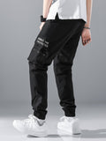 Manfinity Hypemode Loose Fit Men's Slogan Graphic Cargo Pants With Grommet Detail, Flap Pockets, And Drawstring Closure - MapleCo