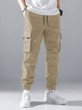 Manfinity Hypemode Loose Fit Men's Slogan Graphic Cargo Pants With Grommet Detail, Flap Pockets, And Drawstring Closure - MapleCo