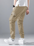 Manfinity Hypemode Loose Fit Men's Slogan Graphic Cargo Pants With Grommet Detail, Flap Pockets, And Drawstring Closure - MapleCo