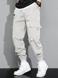 Manfinity Hypemode Loose Fit Men's Cargo Pants With Letter Graphic, Flap Pockets And Drawstring Waist