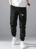 Manfinity Hypemode Loose Fit Men's Cargo Pants With Letter Patching, Flap Pockets, And Drawstring Waist - MapleCo