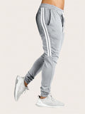 Manfinity Sporsity Men Loose Drawstring Waist Side Tape Sweatpants