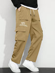 Manfinity Hypemode Men's Casual Cargo Pants With Slogan Graphic, Flap Pocket And Drawstring Waist - MapleCo