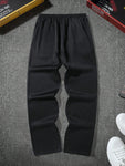 Manfinity Hypemode Men's Loose Solid Color Drawstring Black Sweatpants