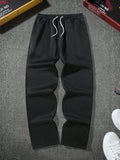 Manfinity Hypemode Men's Loose Solid Color Drawstring Black Sweatpants