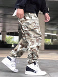 Manfinity Hypemode Loose Fit Men's Camouflage Print Cargo Pants With Flap Pockets Baggy Long Camo Graphic Army Green Going Out