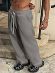 Manfinity Hypemode Men's Loose Solid Color Drawstring Black Sweatpants