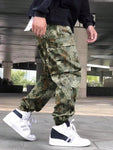 Manfinity Hypemode Loose Fit Men's Camouflage Print Cargo Pants With Flap Pockets Baggy Long Camo Graphic Army Green Going Out