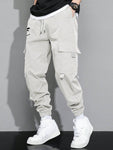 Manfinity Hypemode Loose Fit Men's Cargo Pants With Letter Graphic, Flap Pockets And Drawstring Waist - MapleCo